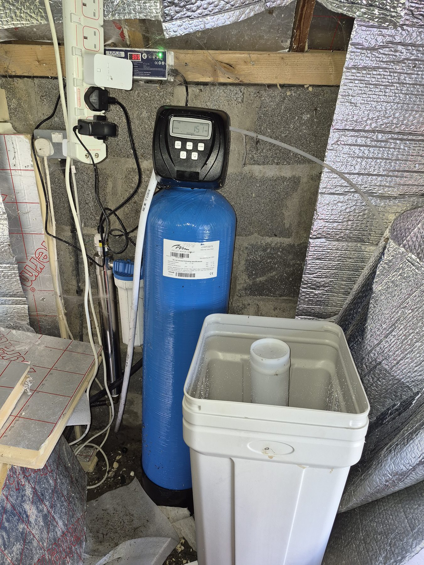 Water softener and sediment filter installed in a garage